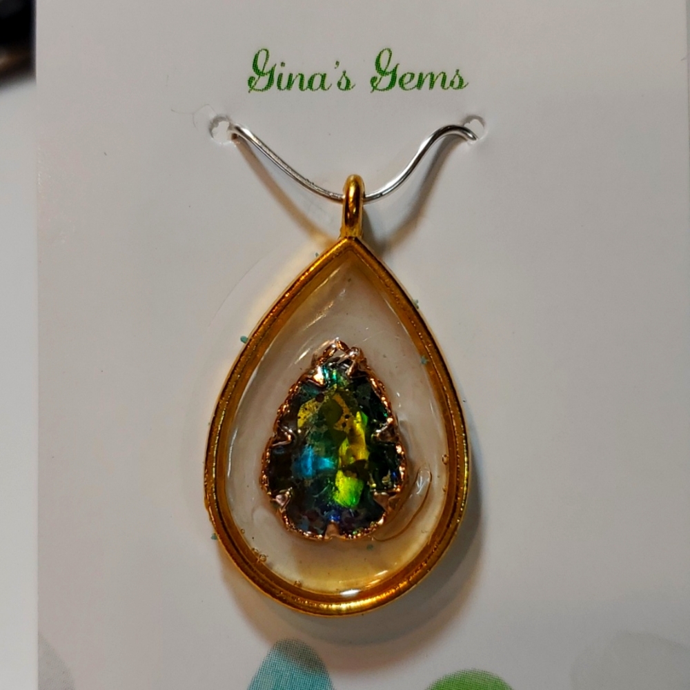 Jewelry  Pendant Resin. Base metal gold With rainbow Stone